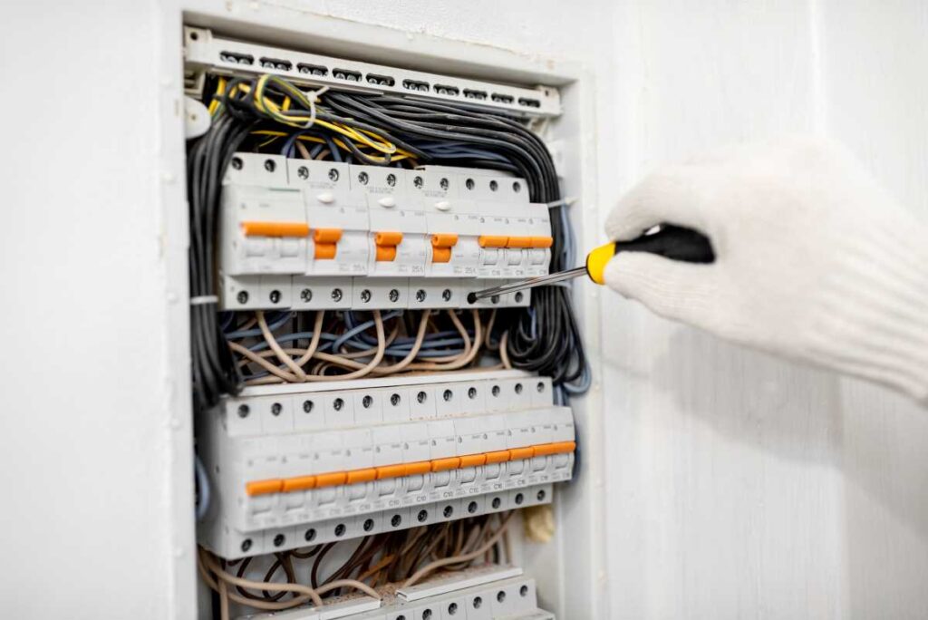 Electrical switchboard being worked on | Featured image for the Home Repair Services Page for Tribella Group.